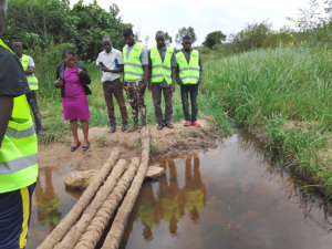 JOYI Staff and some of the Fisherfolk Youth (with branded reflector jackets) visiting one of the ponds in Mukajja Village 