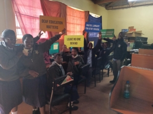 Deaf Learners at Reverend Muhoro School in Nyeri County interacting with the offline Learning Management System, Deaf Digital Library, which has appropriate and accessible Sexual and Reproductive Health information