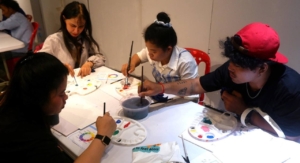 Participants learning the basics of the color mixing theory