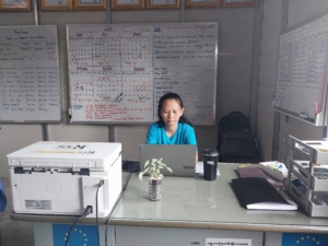 Kimsan at the office, going through her daily tasks